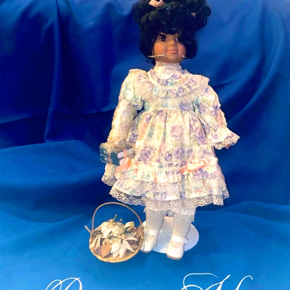Lovely Porcelain collectible doll named "Vanessa." Print dress & petticoat.